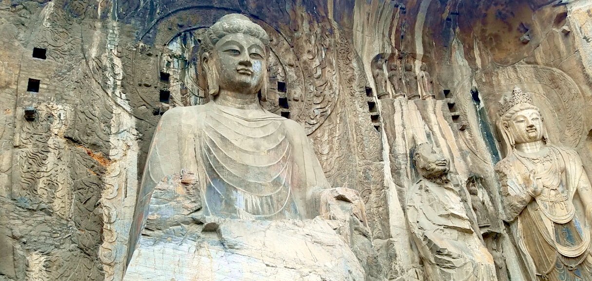 Longmen Grottoes Buddhist statues along Yi River Luoyang China