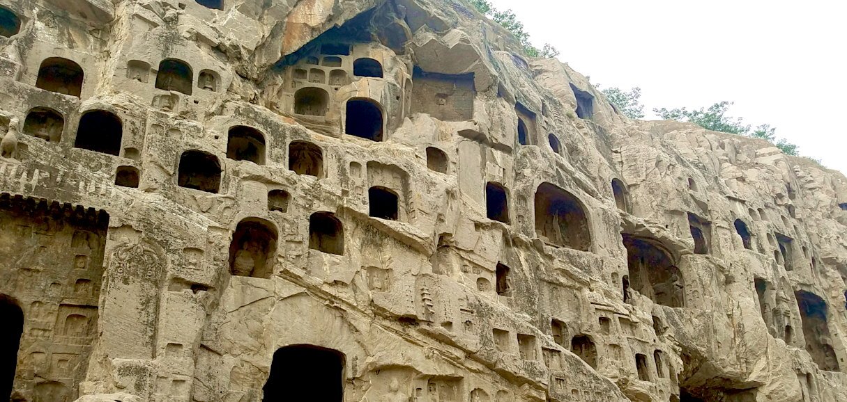 Longmen Grottoes Buddhist statues along Yi River Luoyang China